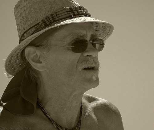 The old man in a straw hat.